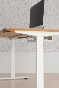 bamboo desk with white frame and computer