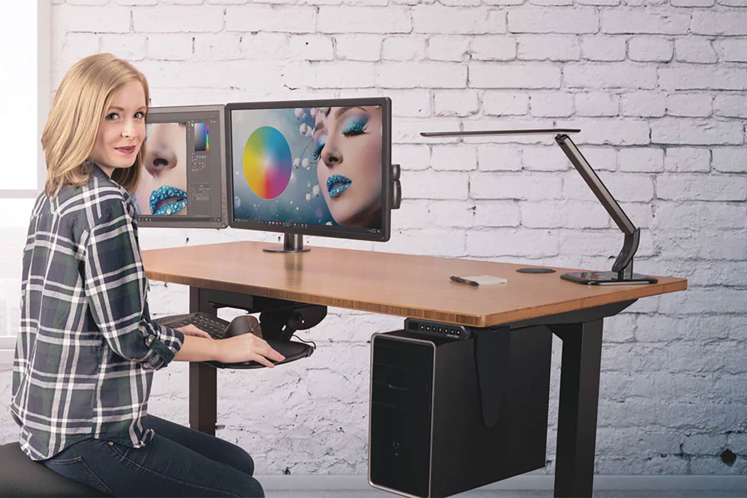 woman doing graphic design at stand desk