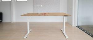 bamboo standing desk with white lamp